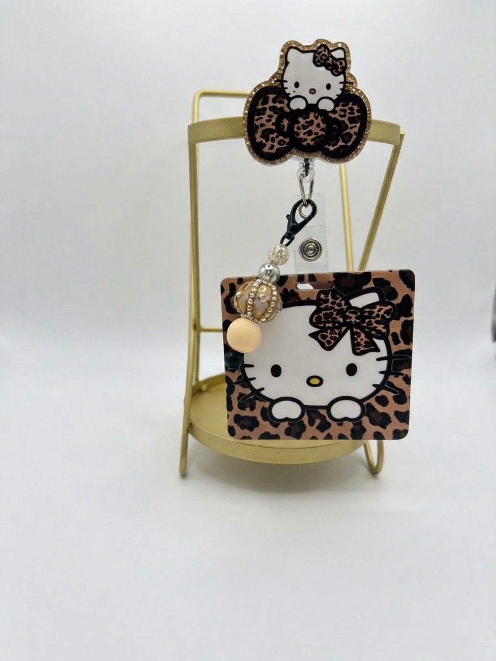 Hello Kitty Leopard Print Badge Reel with Beaded Charm - Brown